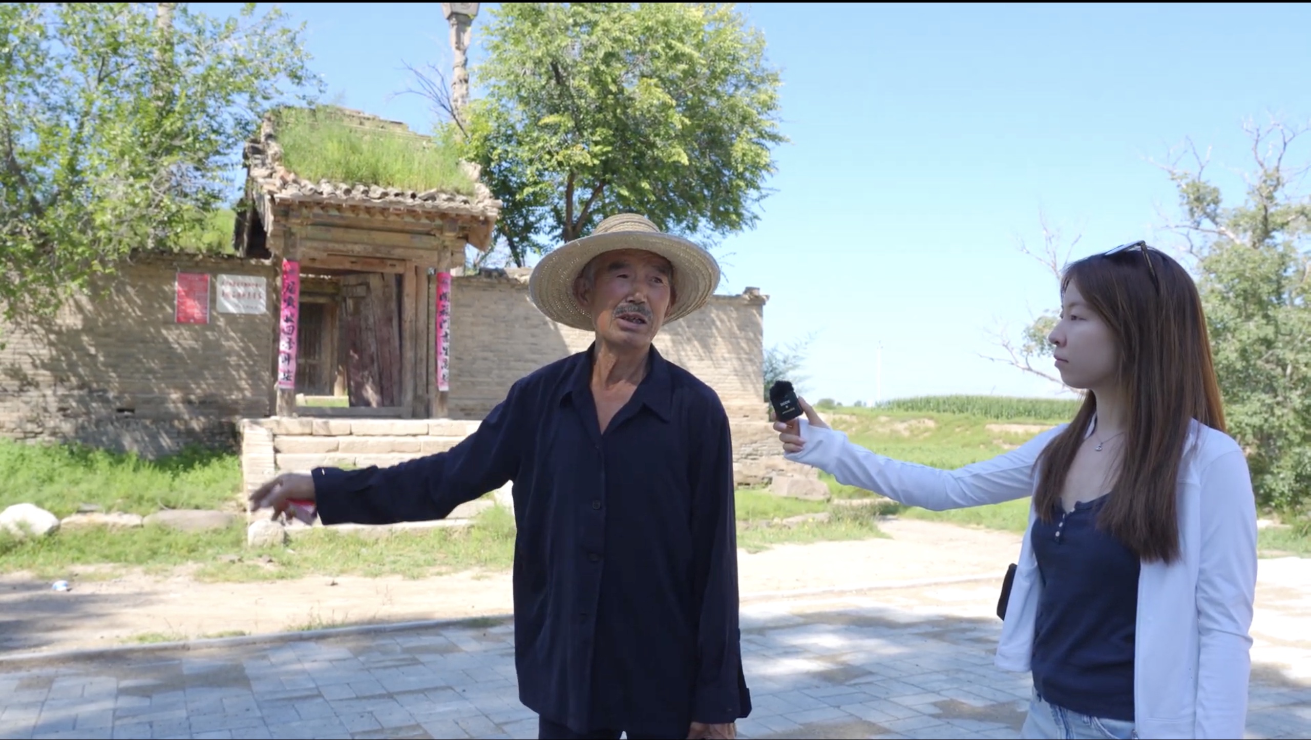 A documentary interview outside a historic building