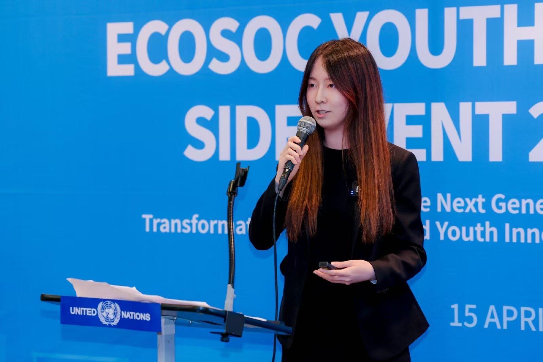 Qianhao Han speaking at a United Nations podium during the 2026 ECOSOC Youth Forum side event